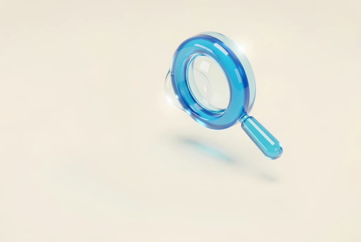A blue 3D magnifying glass on soft beige — finding qualified leads among the right companies